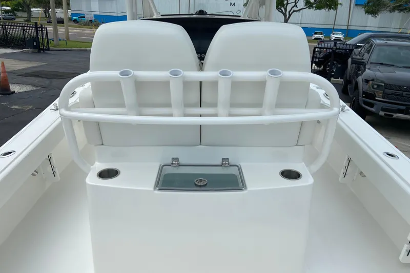 Slide: The Image of 2027 Regulator 26XO boat interior with rod holders and storage compartment. - 12