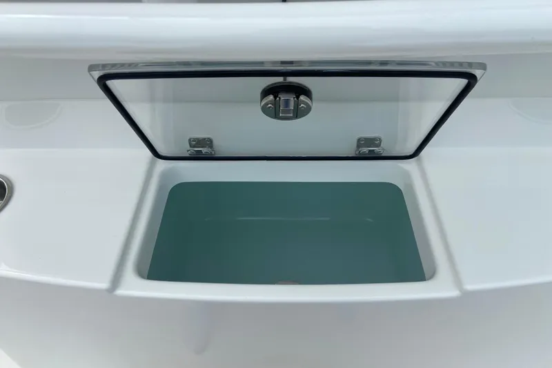 Slide: The Image of Livewell compartment on a 2027 Regulator 26XO boat, featuring a transparent lid. - 14