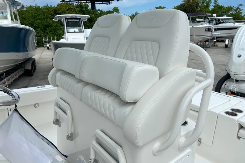Slide: The Image of Luxury seating on a 2027 Regulator 26XO boat, featuring plush white upholstery. - 21