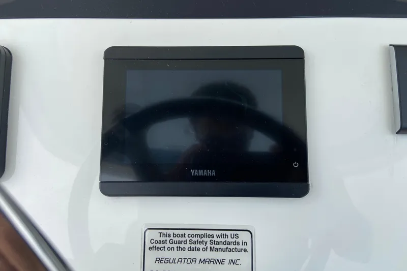 Slide: The Image of Yamaha display on 2027 Regulator 26XO boat dashboard with safety compliance notice. - 29