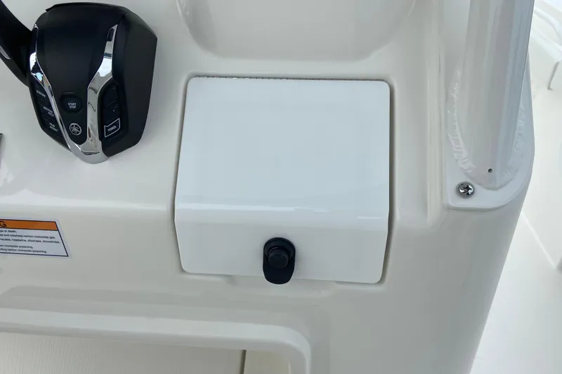 Slide: The Image of Control panel of 2027 Regulator 26XO boat with throttle and switches. - 31