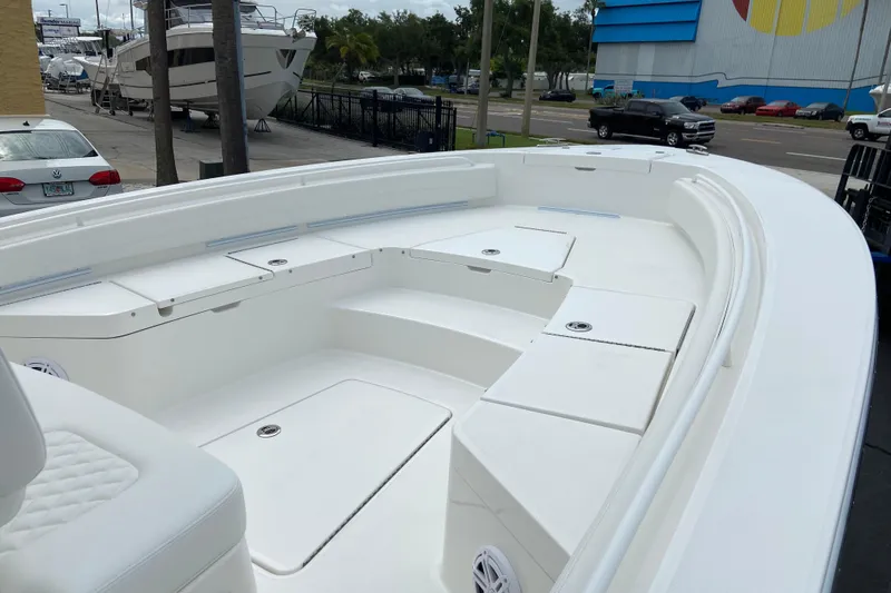Slide: The Image of 2027 Regulator 26XO boat interior with spacious seating and storage compartments. - 33