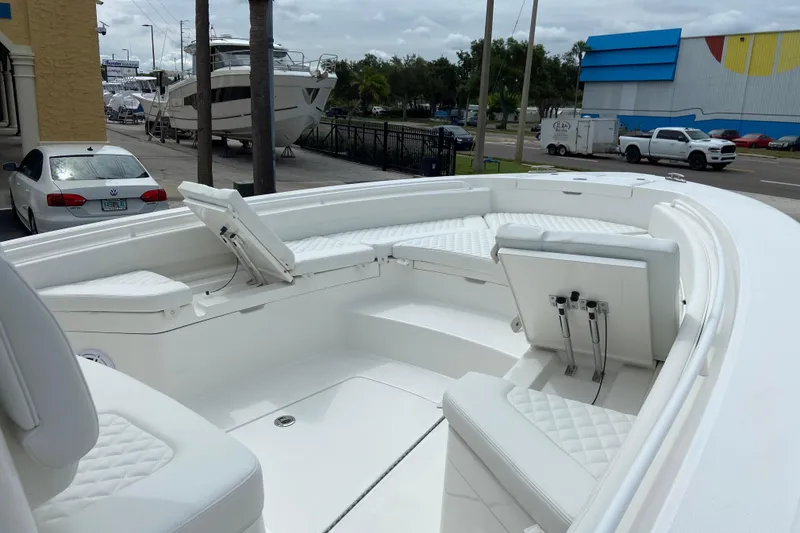 Slide: The Image of 2027 Regulator 26XO boat interior with white seating and storage compartments. - 35