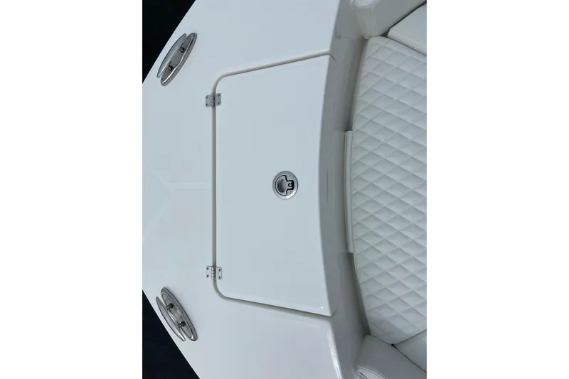 Slide: The Image of 2027 Regulator 26XO boat deck with storage hatch and quilted seating. - 38