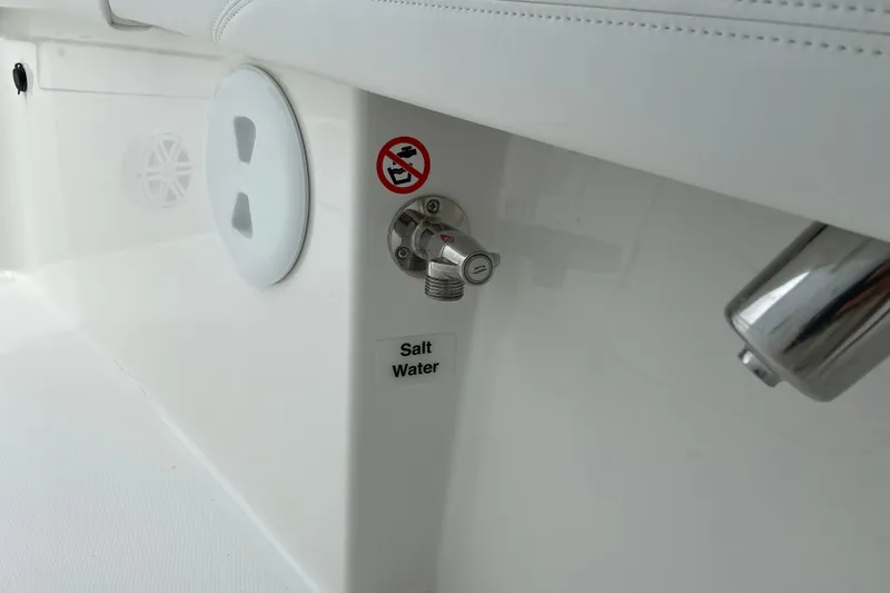 Slide: The Image of 2027 Regulator 26XO boat interior with saltwater faucet and no smoking sign. - 41