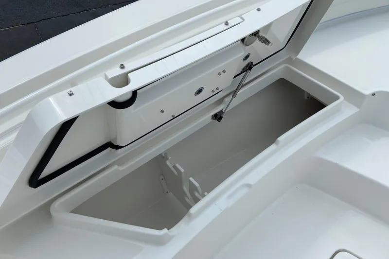 Slide: The Image of Open storage compartment on 2027 Regulator 26XO boat, showcasing interior space. - 51