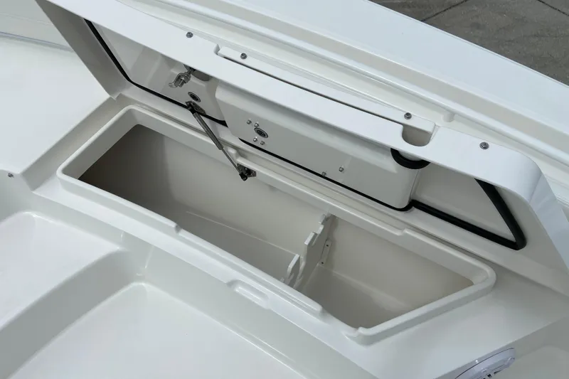 Slide: The Image of Open storage compartment on 2027 Regulator 26XO boat, showcasing spacious interior design. - 53