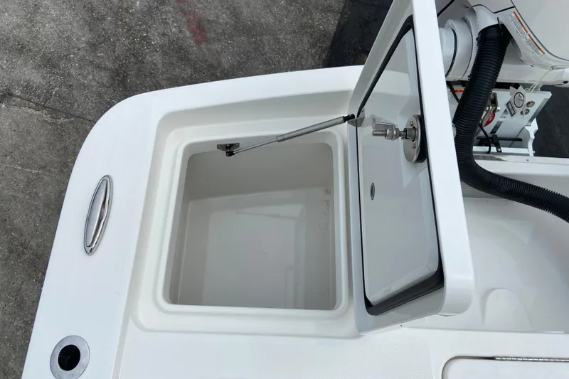Slide: The Image of Open storage compartment on 2027 Regulator 26XO boat, showcasing interior space. - 7