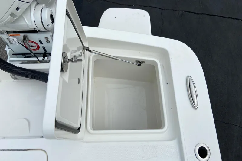 Slide: The Image of Open storage compartment on a 2027 Regulator 26XO boat, showcasing interior details. - 8