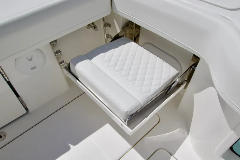 Slide: The Image of White cushioned seat on 2027 Regulator 35 boat, featuring sleek design and modern fittings. - 14