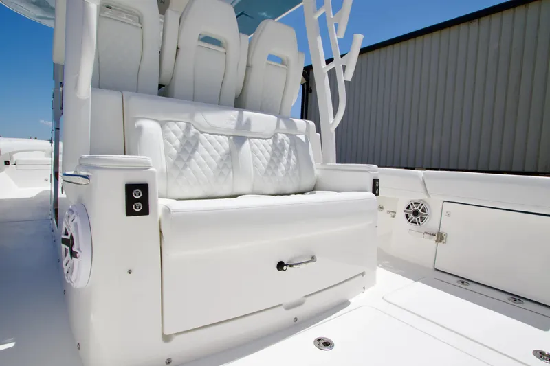 Slide: The Image of Luxurious seating on 2027 Regulator 35 boat, featuring white quilted upholstery and modern design. - 15