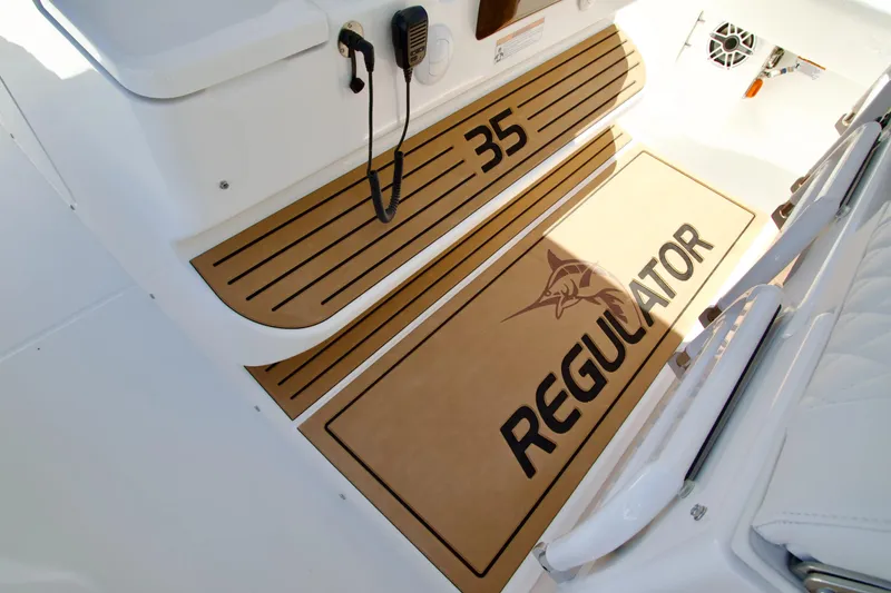 Slide: The Image of 2027 Regulator 35 boat interior with branded flooring and communication equipment. - 19