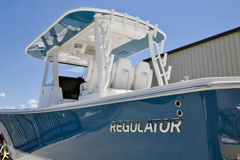 Slide: The Image of 2027 Regulator 35 boat with sleek blue hull and modern design. - 2