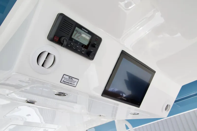 Slide: The Image of 2027 Regulator 35 boat dashboard with Garmin electronics and control panel. - 20