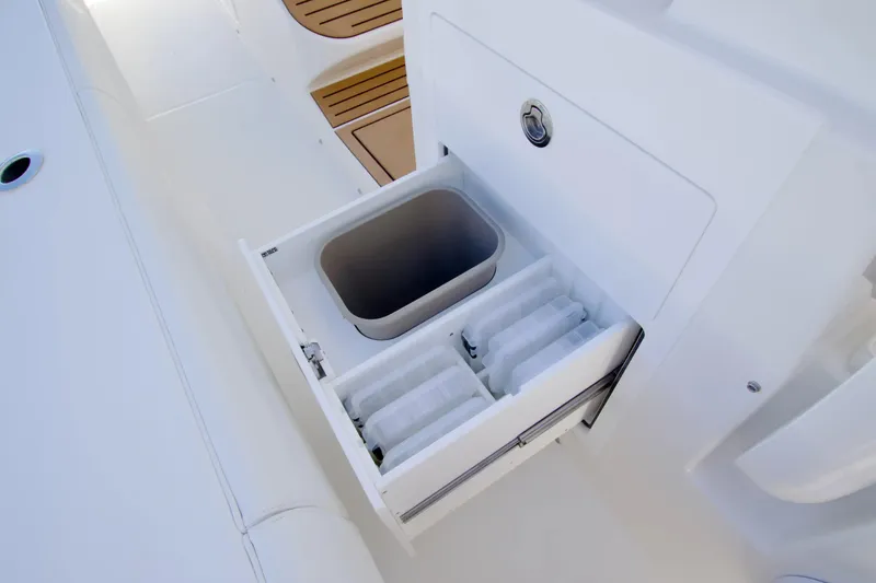 Slide: The Image of Open storage compartment on 2027 Regulator 35 boat with organized interior. - 21