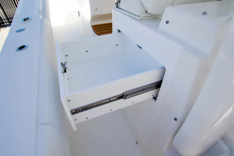 Slide: The Image of Open storage drawer on 2027 Regulator 35 boat, showcasing sleek white design. - 22