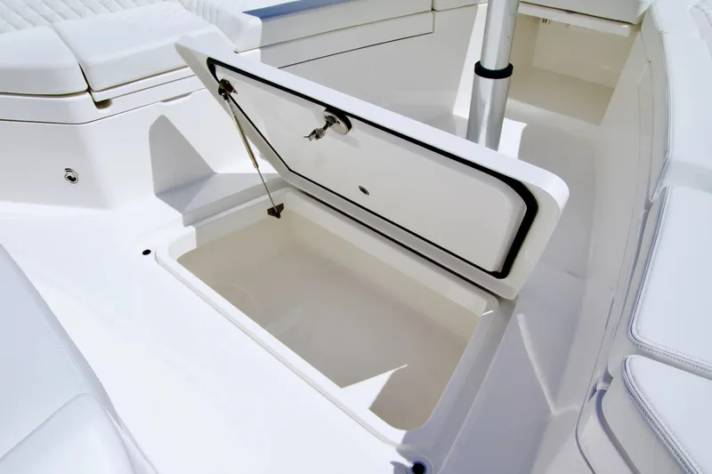 Slide: The Image of Open storage compartment on 2027 Regulator 35 boat, showcasing sleek white interior design. - 26