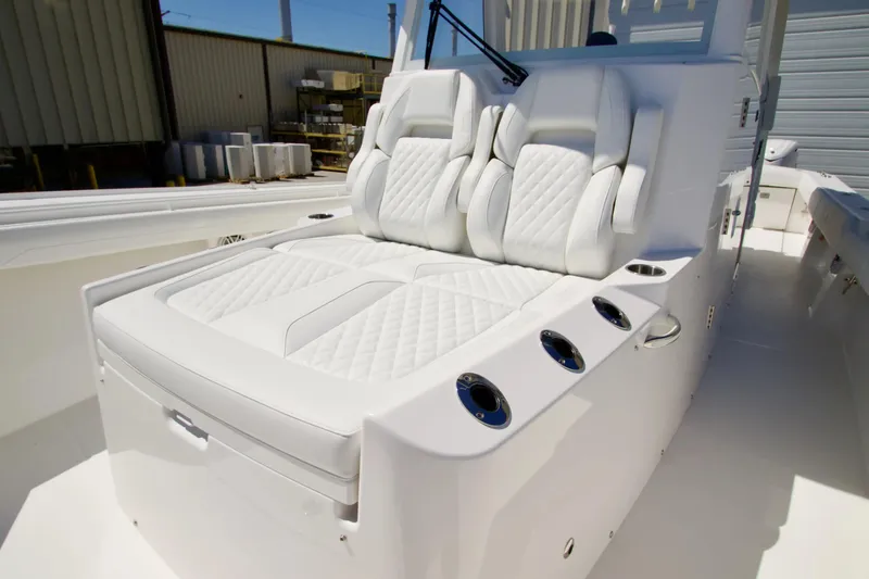Slide: The Image of Luxurious seating on 2027 Regulator 35 boat, featuring white quilted upholstery and sleek design. - 28