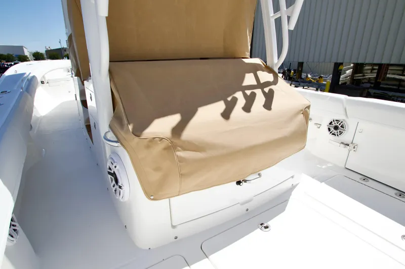 Slide: The Image of 2027 Regulator 35 boat interior with beige seat cover and white speakers. - 32