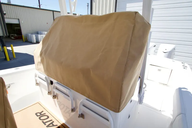 Slide: The Image of 2027 Regulator 35 boat with covered console in a marina setting. - 34