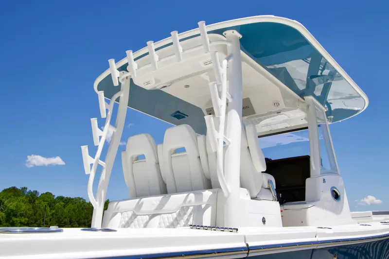 Slide: The Image of 2027 Regulator 35 boat with sleek design and modern seating under a clear blue sky. - 5