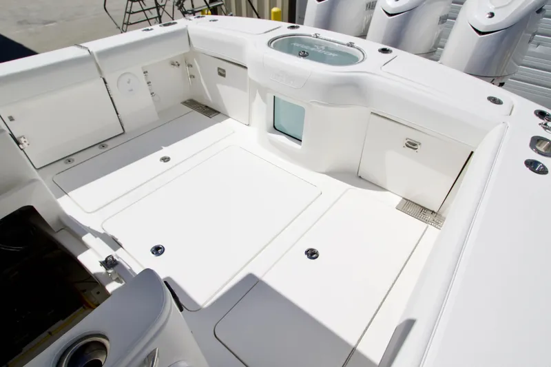 Slide: The Image of 2027 Regulator 35 boat deck with storage compartments and sleek design. - 8