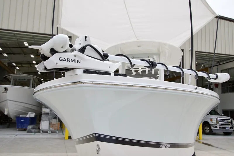 Slide: The Image of 2026 Regulator 26XO boat with Garmin equipment in a storage facility. - 2