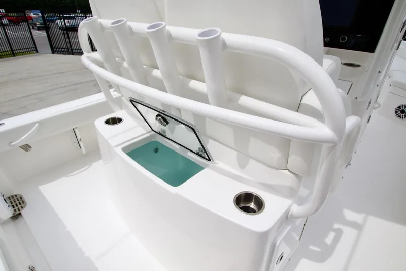 Slide: The Image of 2026 Regulator 26XO boat interior with rod holders and livewell. - 22
