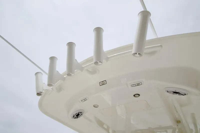Slide: The Image of Regulator 26XO 2026 boat with rod holders and speakers on the deck. - 23