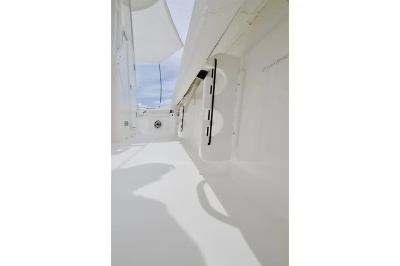 Slide: The Image of Interior view of 2026 Regulator 26XO boat, showcasing sleek white design and storage features. - 24