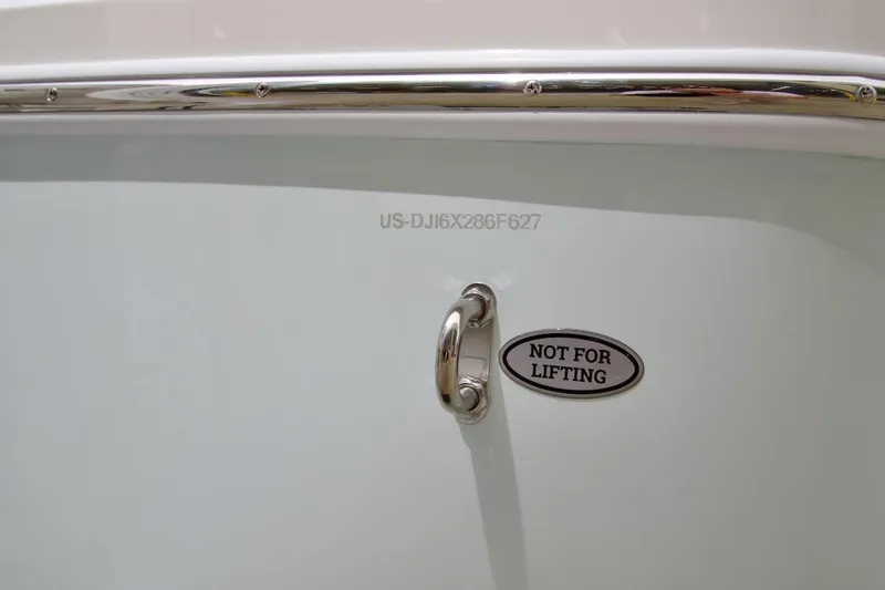 Slide: The Image of 2026 Regulator 26XO boat detail with "Not for Lifting" warning label. - 28