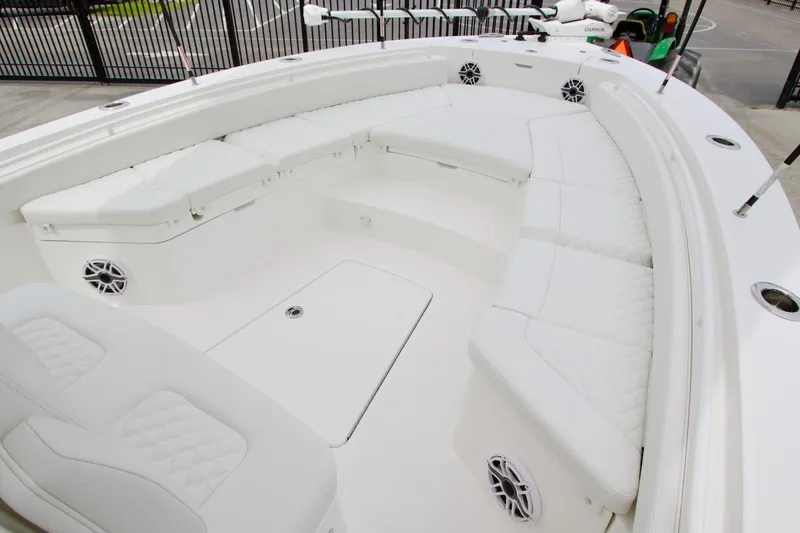 Slide: The Image of 2026 Regulator 26XO boat interior with white cushioned seating and modern design. - 3