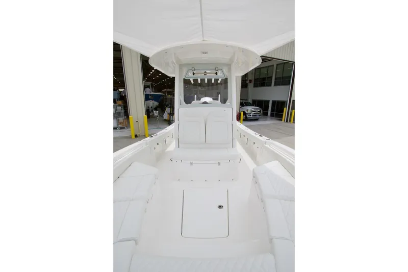 Slide: The Image of 2026 Regulator 26XO boat interior with white seating and helm station. - 4