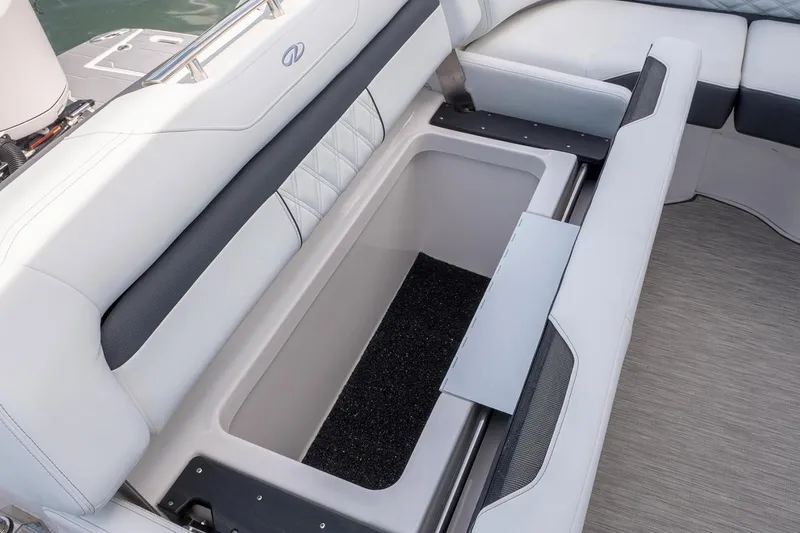 Slide: The Image of Manufacturer Provided Image: 2022 Regal 33 OBX boat with open storage compartment in seating area. - 11