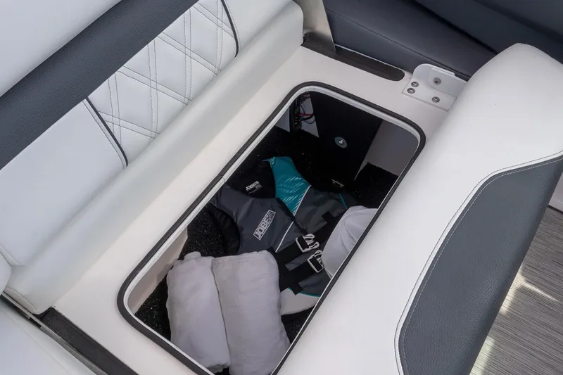 Slide: The Image of Manufacturer Provided Image: Storage compartment in 2022 Regal 33 OBX boat with life jackets and pillows. - 12