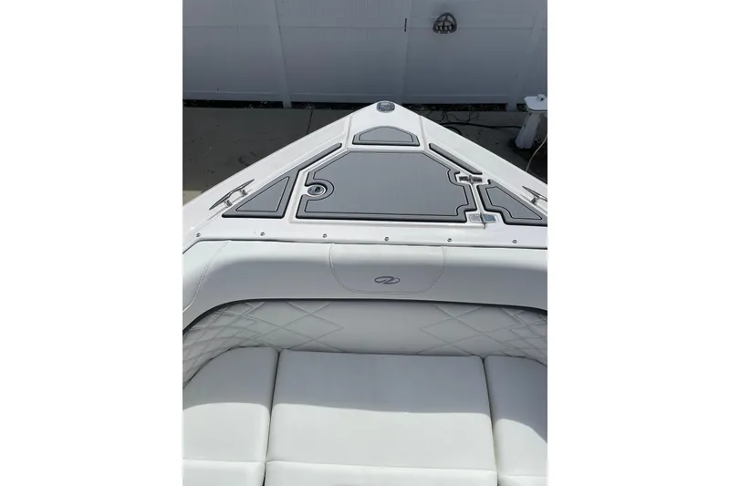 Slide: The Image of 2022 Regal 33 OBX boat interior with sleek seating and modern design. - 16