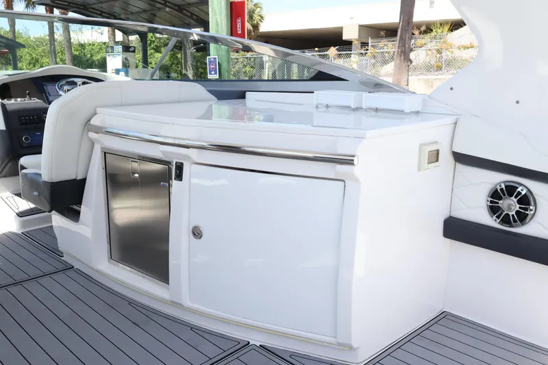 Slide: The Image of 2022 Regal 33 OBX boat interior with sleek cabinetry and modern design. - 19