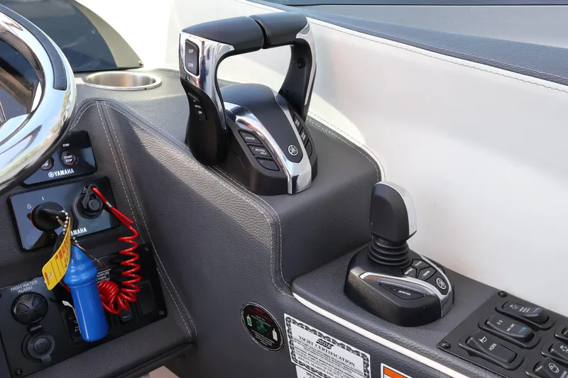 Slide: The Image of 2022 Regal 33 OBX boat controls with Yamaha throttle and joystick. - 29