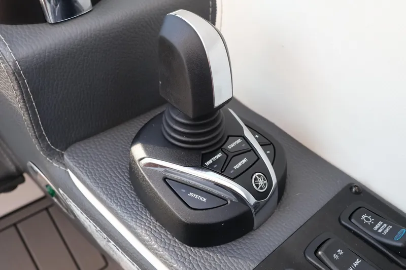 Slide: The Image of Joystick control on 2022 Regal 33 OBX boat dashboard, featuring Yamaha functions. - 30