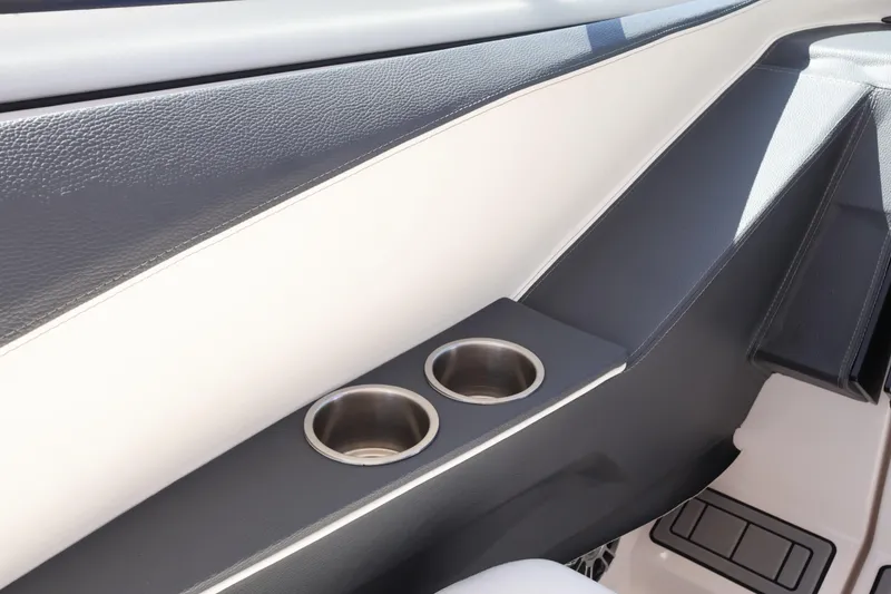 Slide: The Image of Interior of 2022 Regal 33 OBX boat featuring dual stainless steel cup holders. - 34