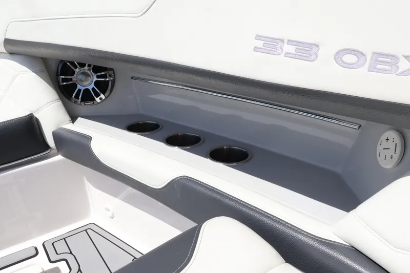 Slide: The Image of Interior of 2022 Regal 33 OBX boat with cup holders and speaker. - 40