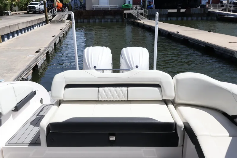 Slide: The Image of Manufacturer Provided Image: 2022 Regal 33 OBX cabin interior with bed and wooden steps. - 44