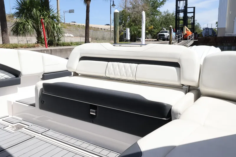 Slide: The Image of Manufacturer Provided Image: 2022 Regal 33 OBX cabin interior with cozy bed and decorative pillows. - 45