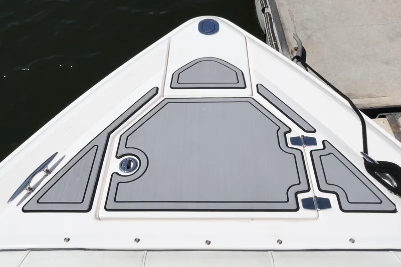 Slide: The Image of Bow of 2022 Regal 33 OBX boat with sleek deck design and cleats. - 46