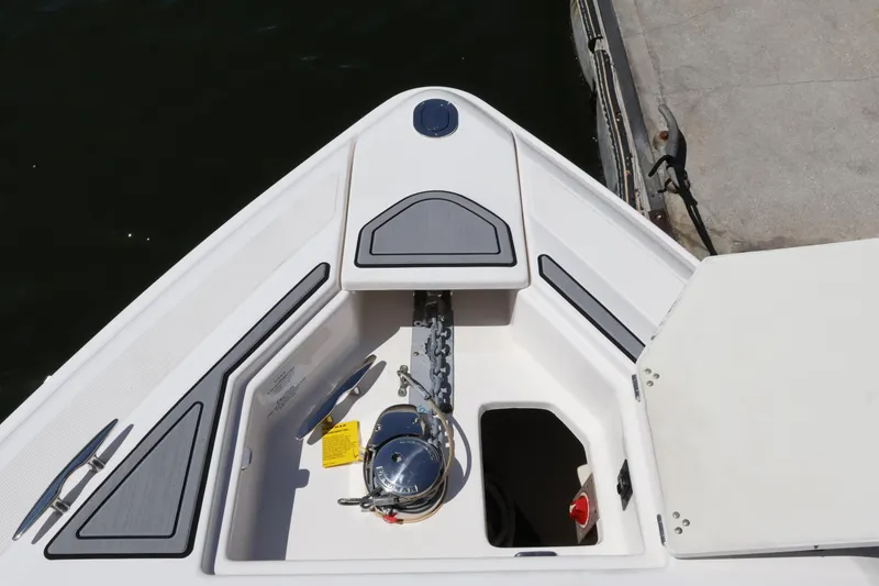 Slide: The Image of Bow anchor compartment of 2022 Regal 33 OBX boat, featuring sleek design and storage space. - 47