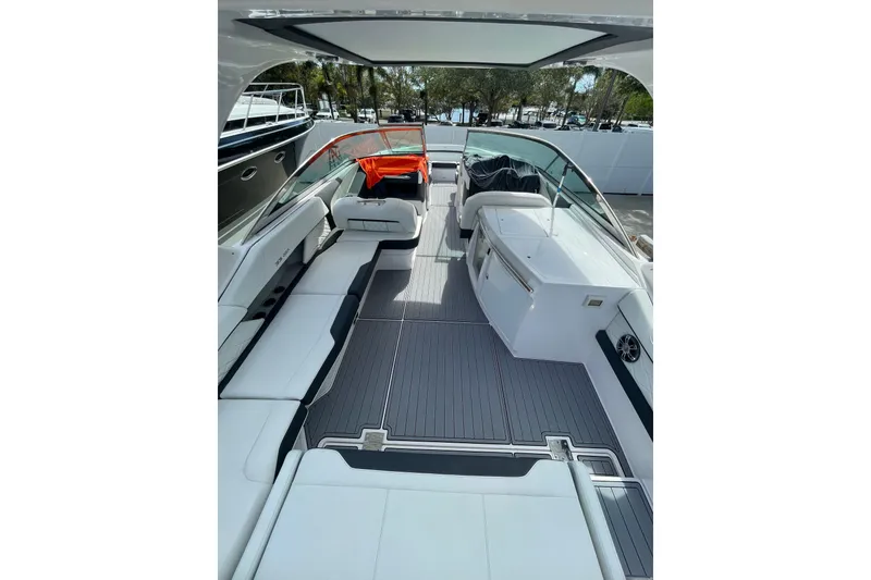 Slide: The Image of 2022 Regal 33 OBX boat interior with sleek seating and modern design. - 7