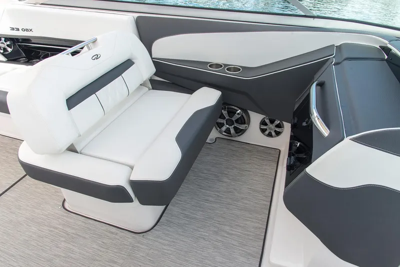 Slide: The Image of Manufacturer Provided Image: 2022 Regal 33 OBX boat interior with white and gray seating. - 8
