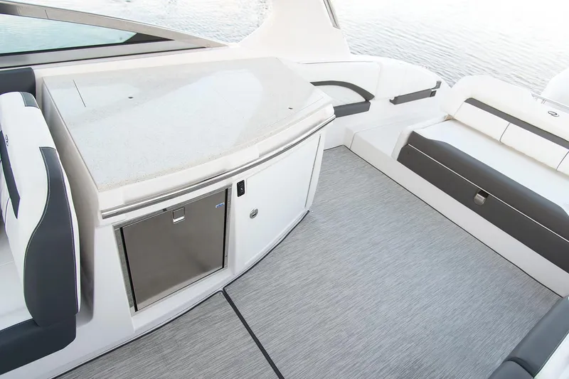 Slide: The Image of Manufacturer Provided Image: 2022 Regal 33 OBX boat interior with seating and kitchenette. - 9