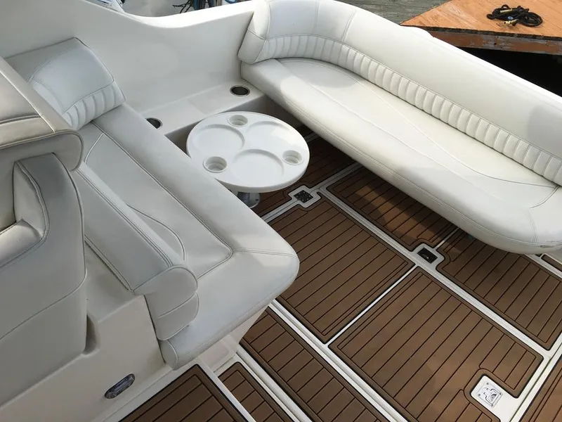 Slide: The Image of Interior of a 2004 Cruisers Yachts 3372 Express with white seating. - 15