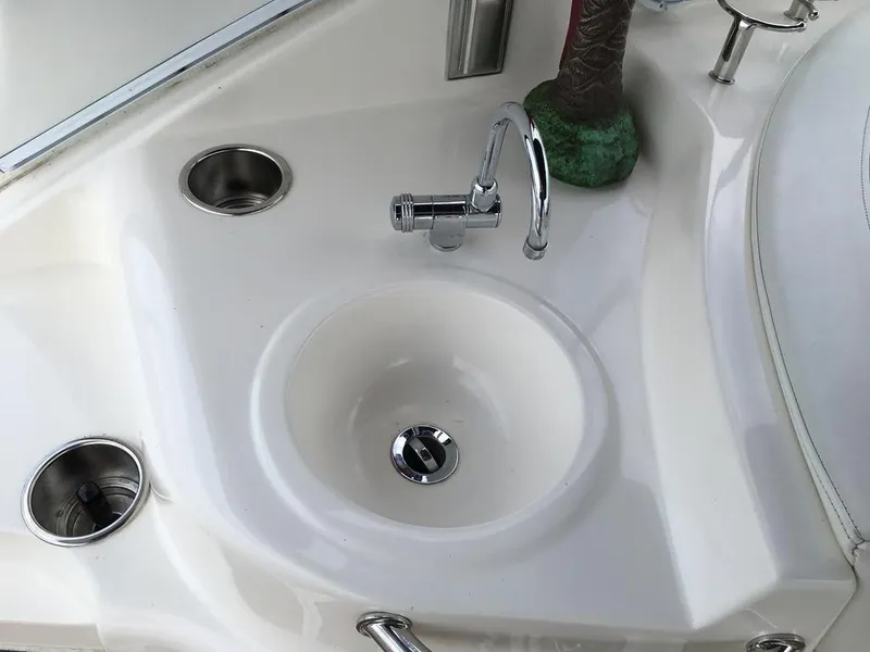 Slide: The Image of Cruisers Yachts 3372 Express 2004 kitchen area with sink. - 21